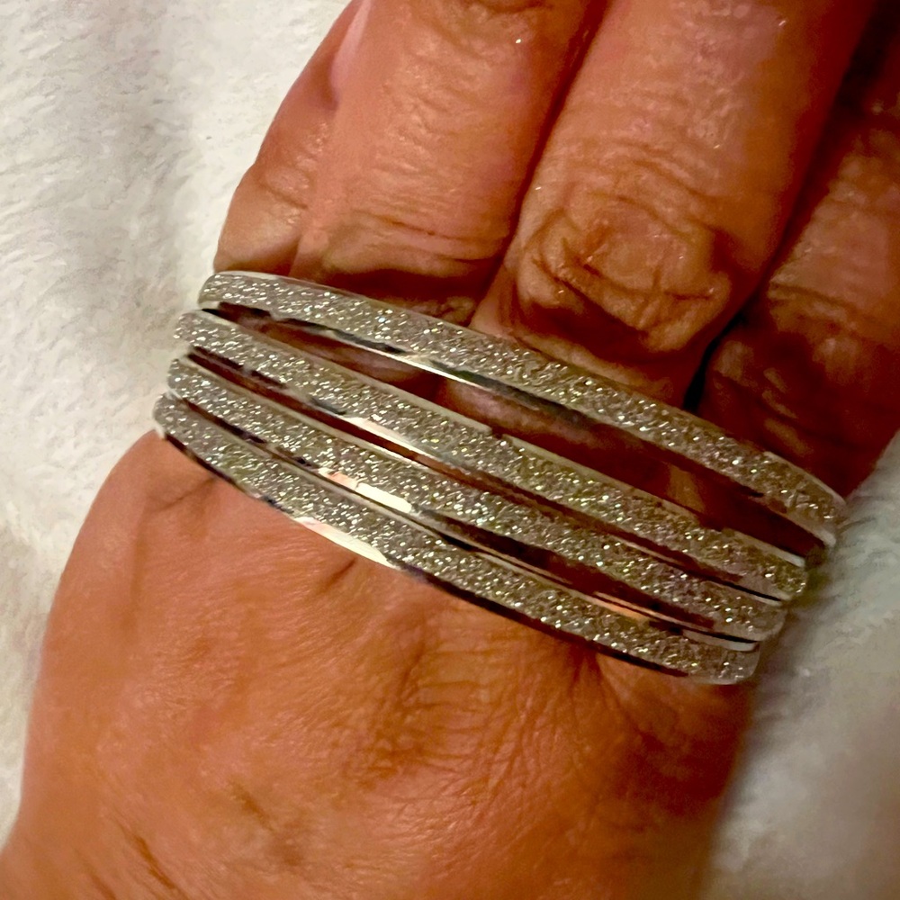 Silver planted sparkly bracelets set of 4 New